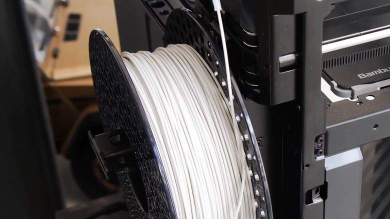 A spool of filament on a 3D printer.
