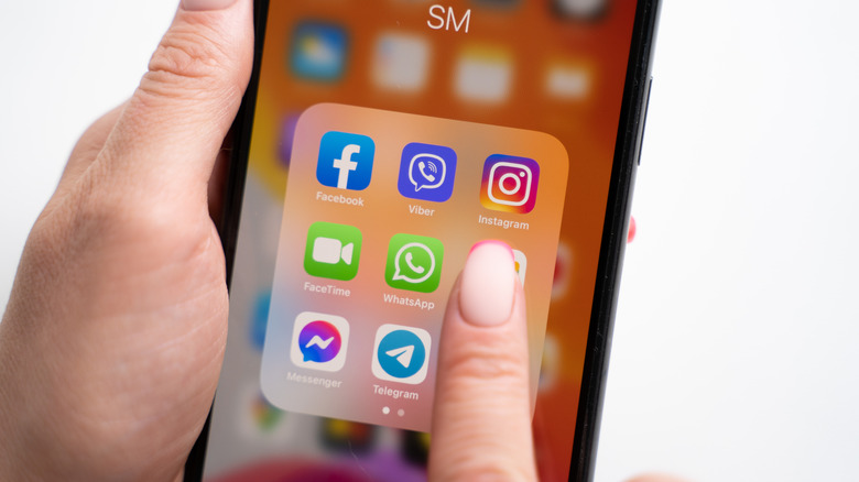 Smartphone screen with social media apps folder