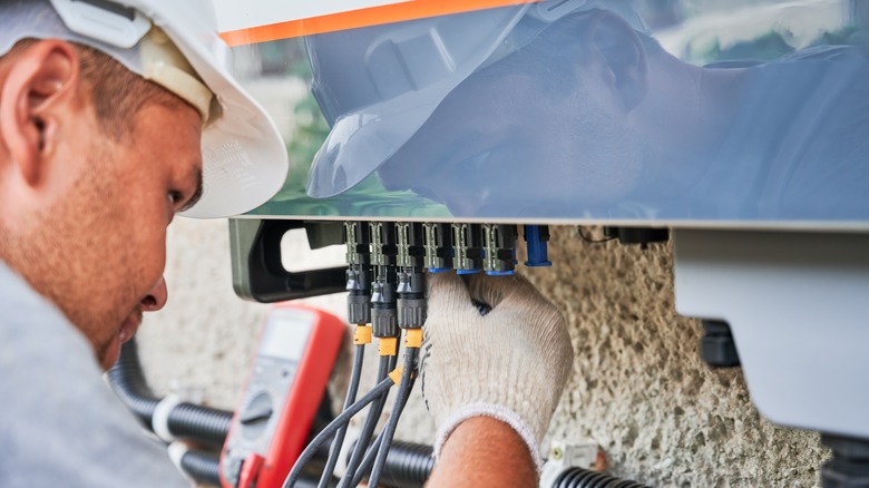 Person installing solar equipment