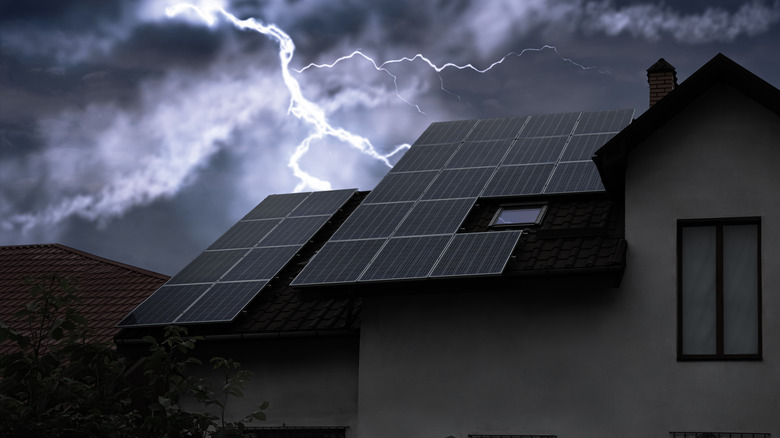 Storm over a house with solar panels