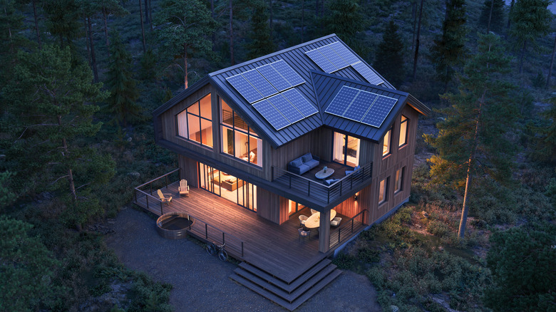 Nighttime aerial view of a home with solar panels