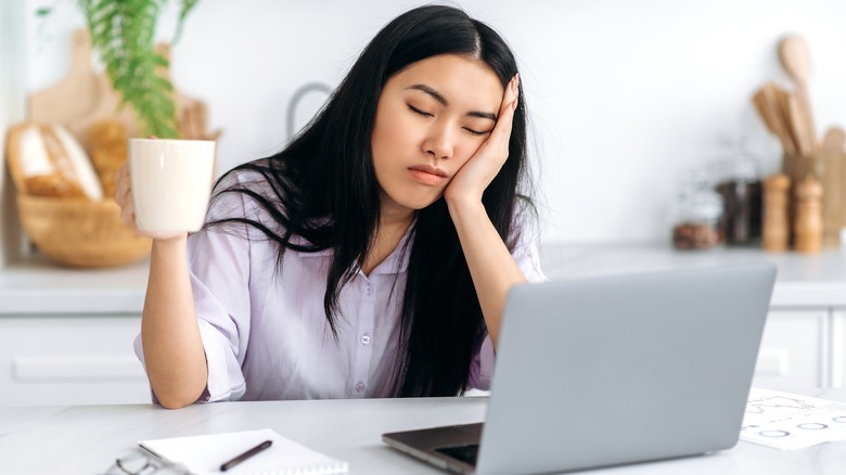 Girl starting work with coffee