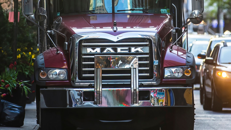 Maroon mack truck parked on street
