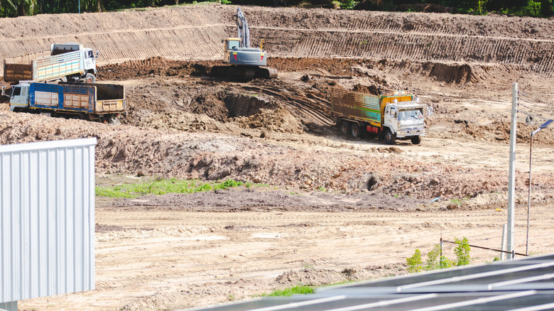 Heavy machinery preparing to build a solar farm.