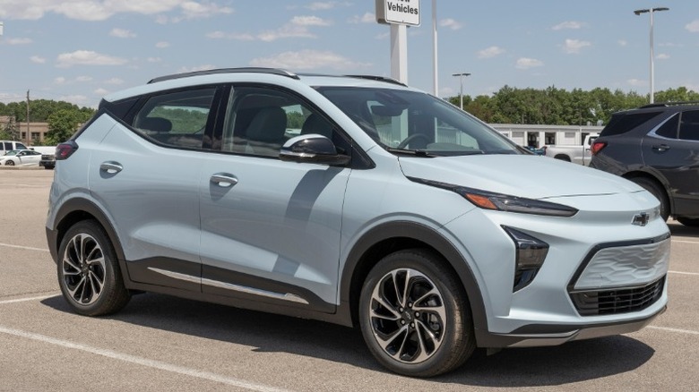 Light blue Chevrolet Bolt EV parked in a lot