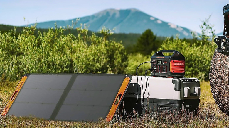 A SolarSaga 100 plugged into a Jackery Explorer 500.