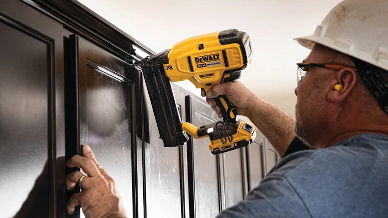 Using brad nailer to fix frames