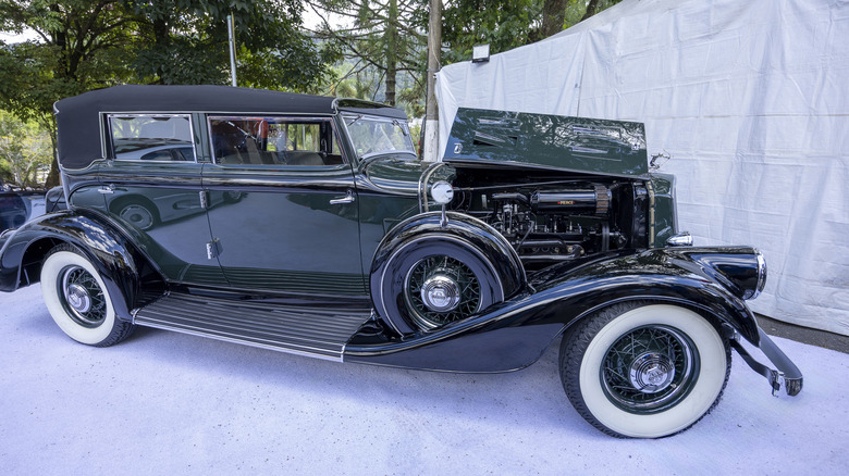 A dark green Pierce Arrow luxury car at car show