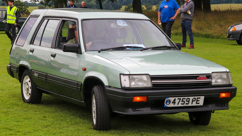 1985 Toyota Tercel station wagon parked on the grass at an outdoor event