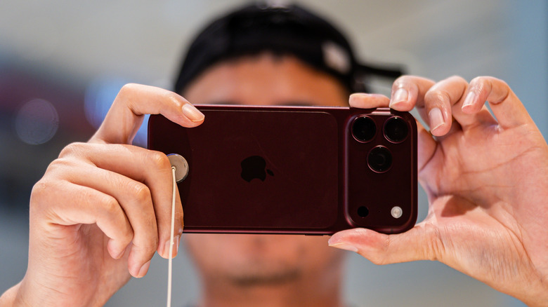 A customer testing iPhone 18 Pro cameras