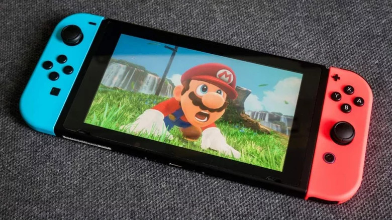 A Nintendo Switch playing Super Mario Odyssey in handheld mode