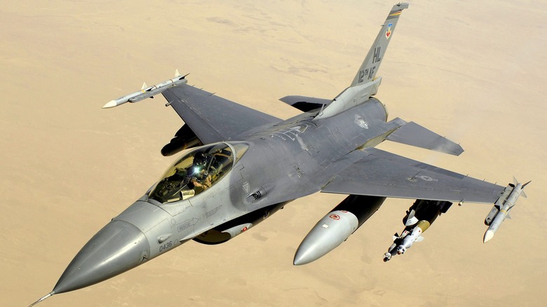 F-16 Fighting Falcon seen from above left on aptrol above a desert