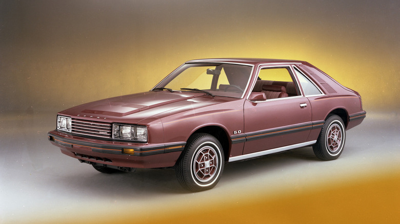 Brown 1979 Mercury Capri seen from left front in studio