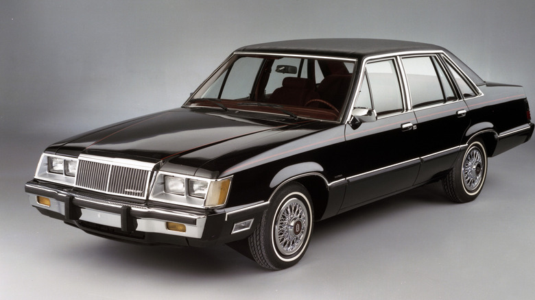 Black 1983 Mercury Marquis Brougham sedan seen from front left in studio