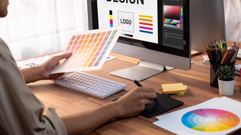 Graphic designer working on a desktop computer