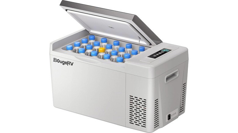 White cooler with half ajar lid and bottled drinks inside