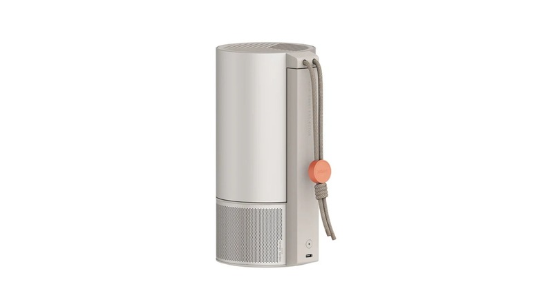Cylindrical portable projector with rope-like carrying handle