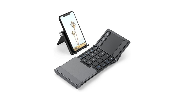 iClever foldable keyboard with trackpad connected to a smartphone
