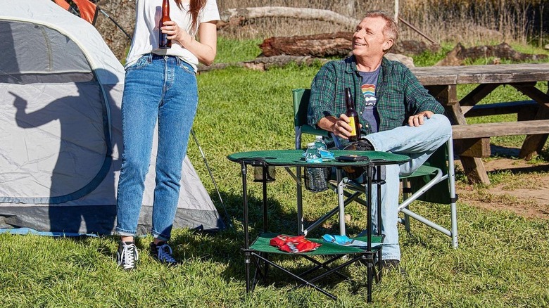 Camper sat at a Harbor Freight camping table