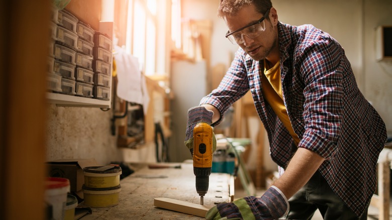 Carpenter working in his woodworking workshop