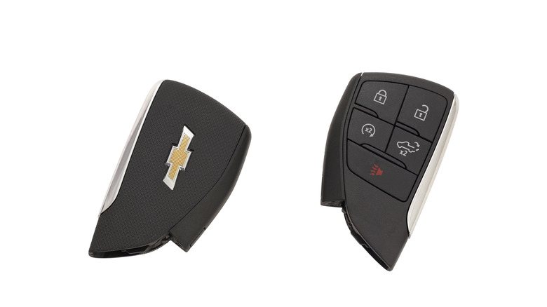 The back and front of a Chevrolet key fob on a white background