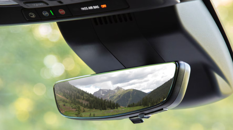 A close-up of the rearview mirror of a Chevy Silverado