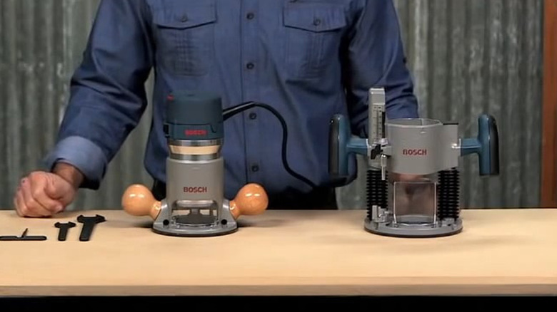 person standing behind table with router, bases, and tools