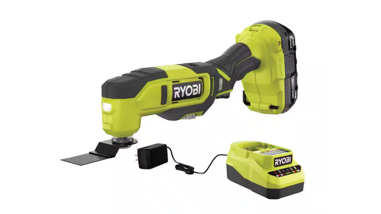 The 18V cordless Oscillating Multi-Tool  from Ryobi with a charger and a battery