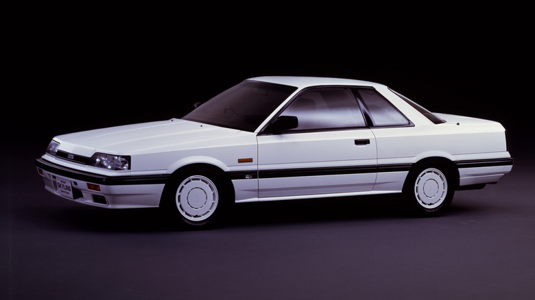 A white Nissan Skyline GTS shown here in the 2 door variant, left two quarters visible