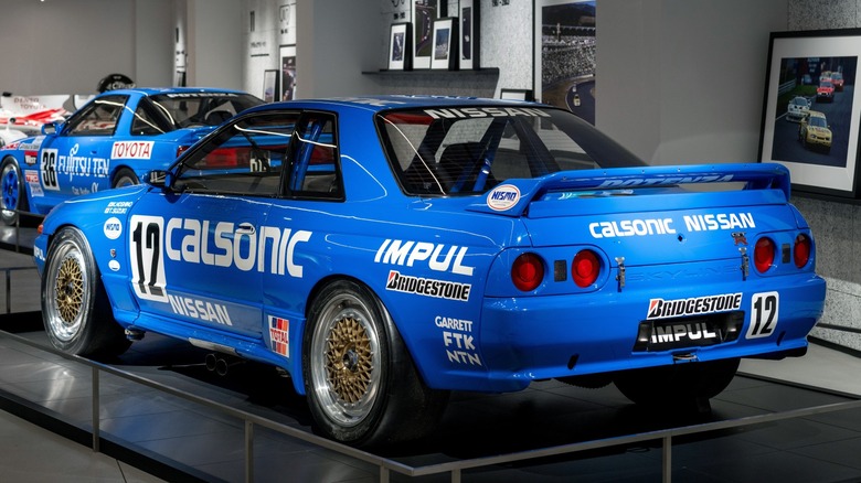 A blue Nissan Skyline R32 GTR on display o the public at the Fuji Speedway auto museum in Japan