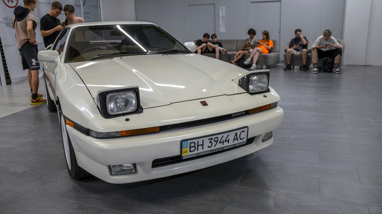 A Toyota Supra A70 from 1988 displayed in Ukraine with its iconic Pop Up Headlights
