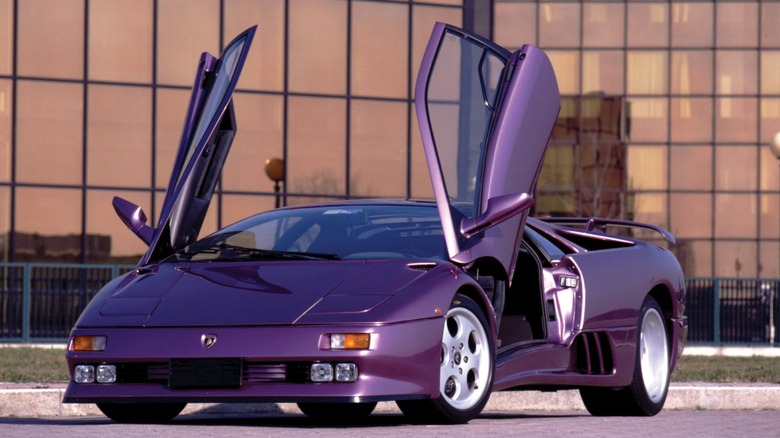Purple Lamborghini Diablo SE parked with doors open