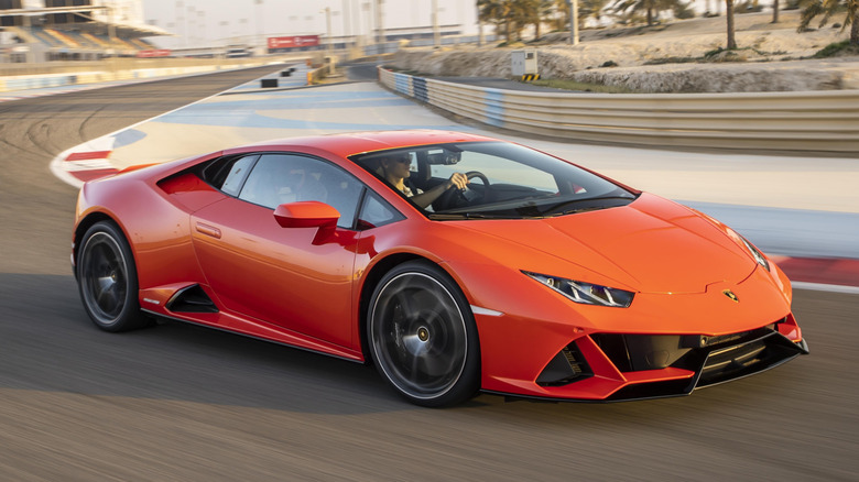 Orange Lamborghini Huracán EVO cornering on track