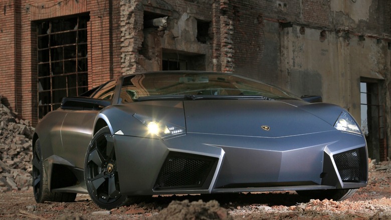 Lamborghini Reventón parked in front of a ruined building