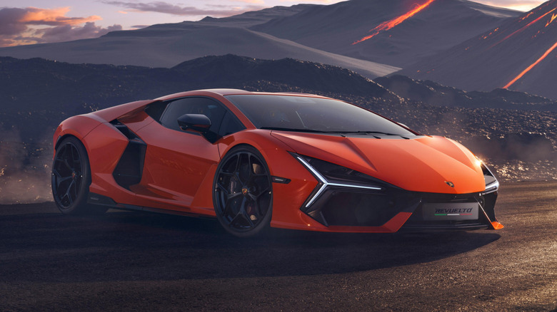 Orange Lamborghini Revuelto parked on a road