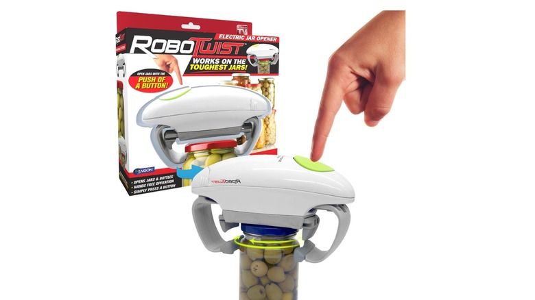 Hand pushing button on automatic jar opener
