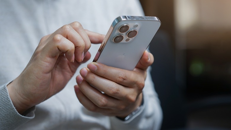 person holding iphone