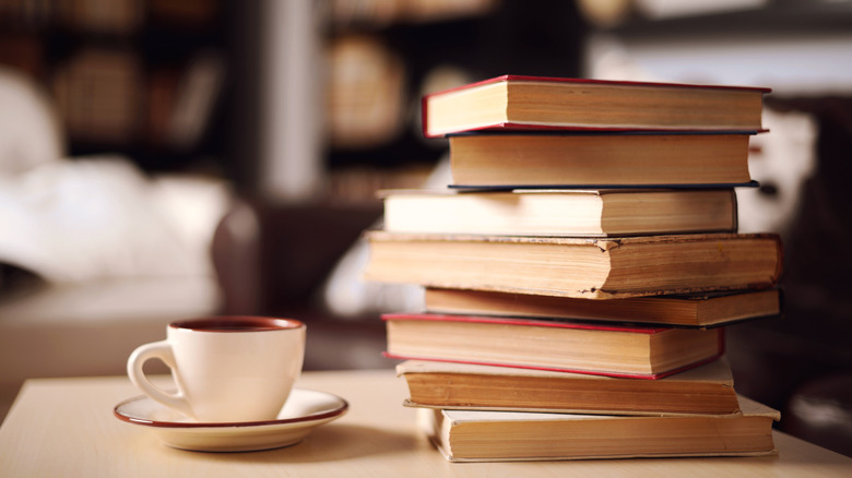 Stack of used books on a coffee table