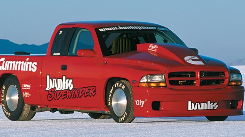 Bright red Banks Sidewinder Dodge Dakota racing truck equipped with a Cummins diesel engine, photographed on the Bonneville Salt Flats.