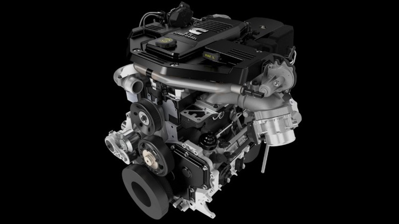 A rendering of a Cummins 6.7L inline-six engine on a black background.