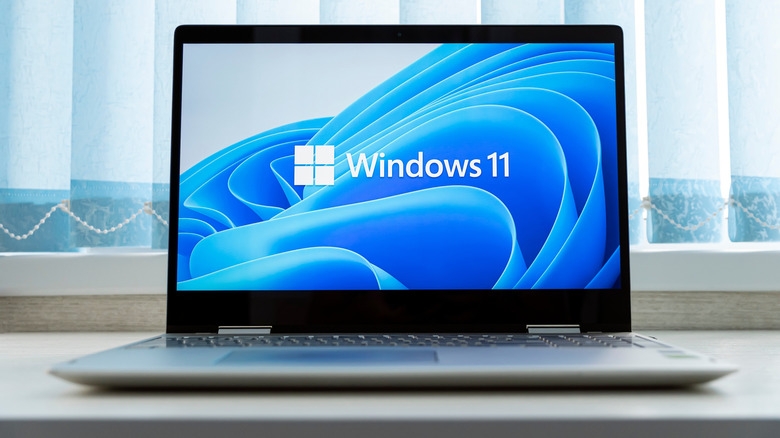 A Windows laptop with the Windows 11 wallpaper