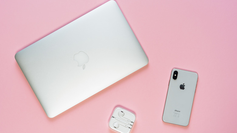 A MacBook, AirPods, and iPhone