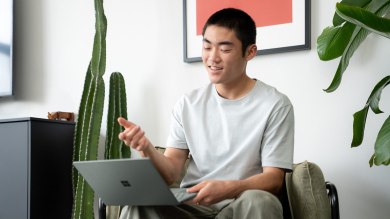 Man takes call with Microsoft Surface