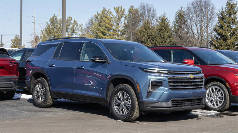 A blue Chevrolet Traverse parked in a lot