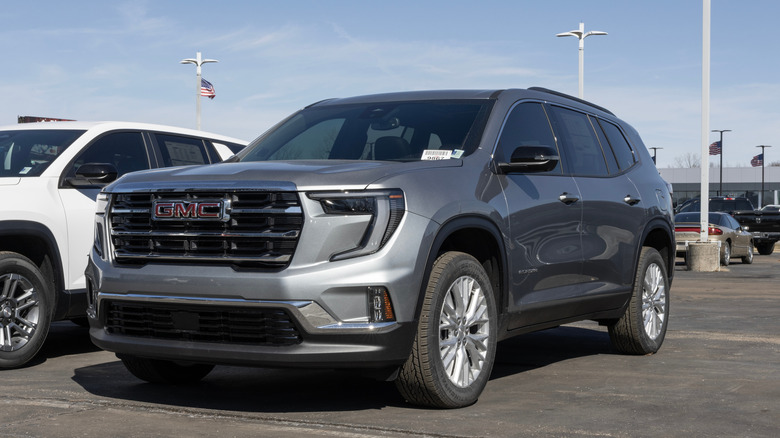 A silver Chevrolet Traverse parked in a lot