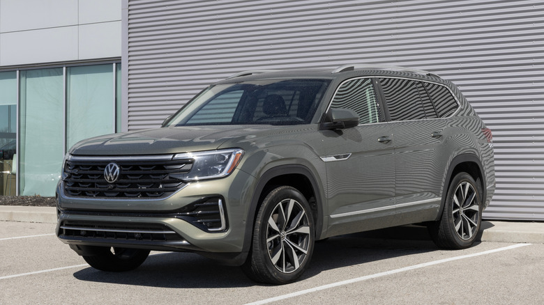 A green Volkswagen Atlas parked in a lot