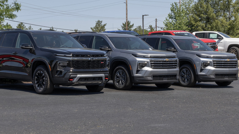 Three Chevrolet Traverse SUVs parked in a lot