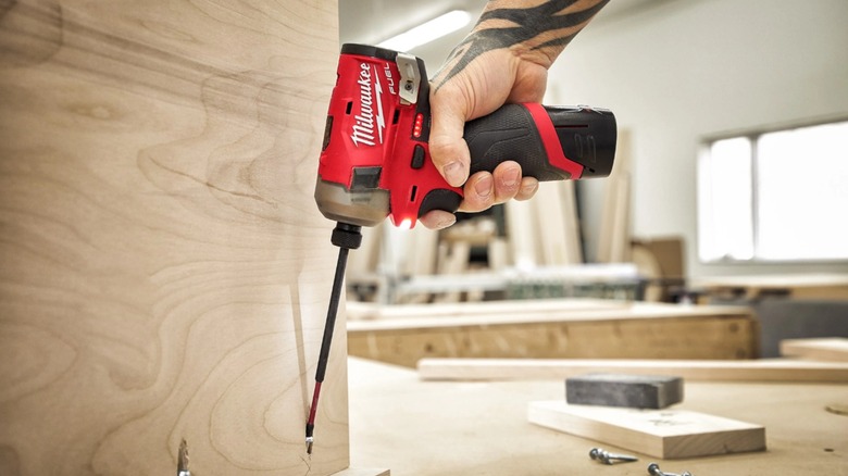 Using hydraulic driver in a wooden surface.