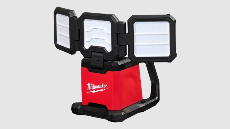 Triple panel flood light with red and black body