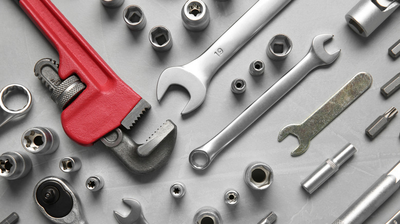 Different tools placed against a grey background
